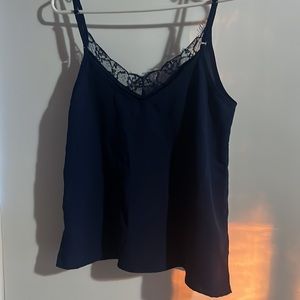 Navy blue flowy tank top with a lace v neck line